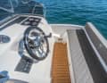 The skipper has full control of the rudder and gears.