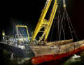 The floating crane has lifted the bow section of the Verity out of the water.