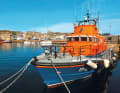 Mooring of the sea rescuers in Lerwick, behind them Victoria Pier.