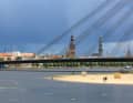 View over the river Daugela with the Vanšu Bridge to the towers of Riga, witnesses of the Brick Gothic and Hanseatic periods.
