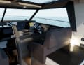 The driving position on starboard. The seat has a solid side support