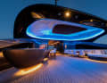 Disco: An illuminated sky towers over the party zone at the back of the top deck.