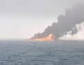 The flames blaze on the high seas, the oil tanker is no longer recognisable.
