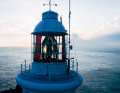 The lighthouse is an important navigational aid for shipping.