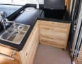 The galley between the saloon and the cockpit is particularly well designed, where the smutje is always in the centre of things.