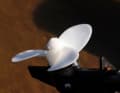 The plastic propeller is secured with a screw at right angles to the hub