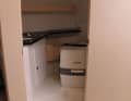 The wet room has a chemical toilet, washbasin, pull-out shower hose, floor drain and a porthole for ventilation