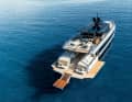 At anchor, the aft bulwarks can be folded down and used as a beach club.  An Opacmare Transformer acts as a bathing ladder.