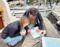 On board, the map study continues.