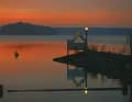 Lake Rheinsberg in the last evening light, in front the harbour entrance