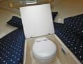 Toilet and bedroom: the toilet is located under the centre cushion of the comfortable bunk. There is a chemical toilet as standard, with a marine version available for an extra charge