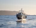 Silent and above the waves. The boat flies over the water with its wings