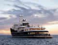 The Aqua Lares on the water. Behind this expedition yacht lies the story of a former icebreaker.