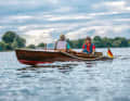Owner Menno Wolters at the helm of his "Nixe" during a trip on the Dove-Elbe near Hamburg