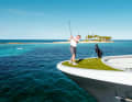 Wide field: "Gene Machines" First Engineer tries to hit the green in the blue in the Bahamas.  If the ball lands in the liquid bunker, it dissolves and becomes fish food
