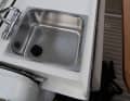 A wet bar with sink and space for a cooker is located between the cockpit and the helm position