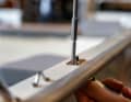 Inserted with a sealant and screwed on, ...
