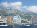 The boats of Team Blue Rising and Aoki against the backdrop of the Monaco skyline.