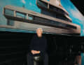 Giorgio Armani in front of his work.
