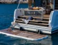 A hydraulically lowerable bathing platform.