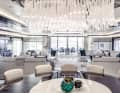 The chandelier above the dining table was supplied by Lasvit, headquartered in the Czech Republic