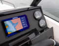 The standard 7-inch Simrad display and the engine displays at the helm.
