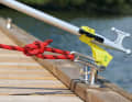 The line is kept under tension and the boat hook is pushed out forwards