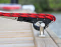 The head extends, at the same time the hook wraps around the cleat and ...