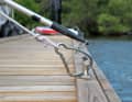 The carabiner clip closes when the boat hook is pulled back