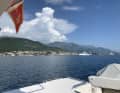 The "Azura" with the guest flag of Montenegro in Porto Montenegro