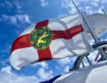 The guest flag of Alderney on the equipment carrier.