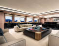 Segmented main saloon: lounge and dining area separated by a sideboard. Vafiadis was keen to create "intimate areas" so that charter guests can withdraw