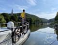 Our yachts at the public jetty in Bad Ems, with the spa gardens and St Martin's tower on the left and the Kaiserbrücke bridge ahead