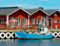 On the Swedish island of Hanö, the tyre fenders on the pier have been chicly painted.