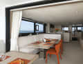 The living area of the trimaran has been cosily furnished