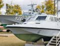 Exhibits on the museum grounds. In the background the KTS "Libelle", in front the border security boat GSB 075