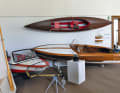 A camping dinghy, a people's paddle boat and a wave binder in the exhibition room of the Museum of Aviation Technology in Rechlin