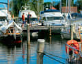 Typical Baltic Sea: "pit lane" with wooden jetties and piles in the Lange Ort marina in Vitte on Hiddensee.