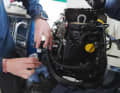 Unscrew the filter housing and pour out the contents.
