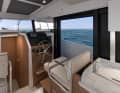 A door leads from the driving position onto the deck
