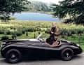 Rolling source of inspiration: Terence Disdale in his Jaguar XK 120, whose sweeping lines, created in 1948, influenced him in his work.