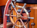 The steamboat is steered in style with the spoked wheel