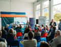 Dr Olaf Toedter from the Karlsruhe Institute of Technology explains the future reduction of greenhouse gases at Lake Constance to the audience.