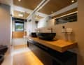 The wet room is staged with indirect light.