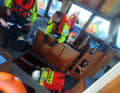 The KNRM volunteers are pumping the water out of the bow.
