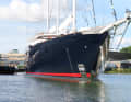 Consistent: The long jib boom comes with a net and water stay. Flaps for the tender garages can be seen in the hull.