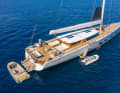 Flaps open, tender out: the large tender is parked on the aft deck, the small one under a hatch on the forecastle.