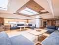 Saloon calm: the teak framing of the skylight opens up the space. Handrails are positioned in sensible places for safe movement below deck.