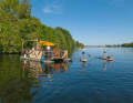 The Dove-Elbe offers more than just peace and quiet. A few very cheerful guys have rented a "water BBQ" island here and are having a good party on a Sunday afternoon.