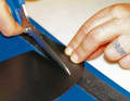 Cut the repair patch generously (a round shape is always better than a square one).